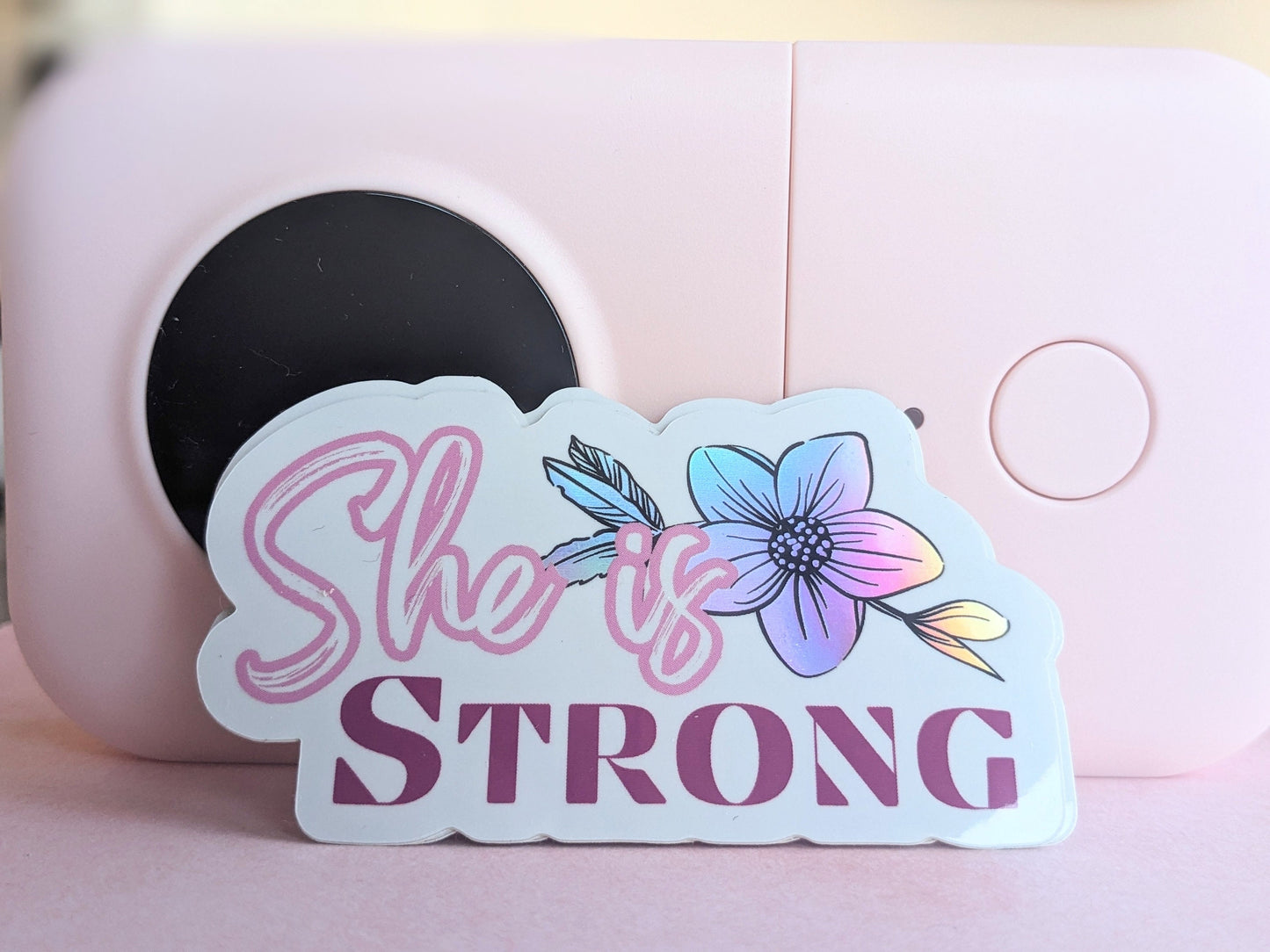 Sticker(holographic) - "She is Strong"